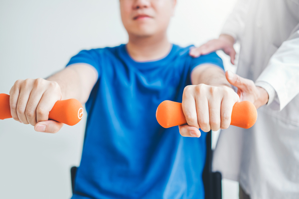 Physiotherapist Man Giving Exercise With Dumbbell Treatment Abou