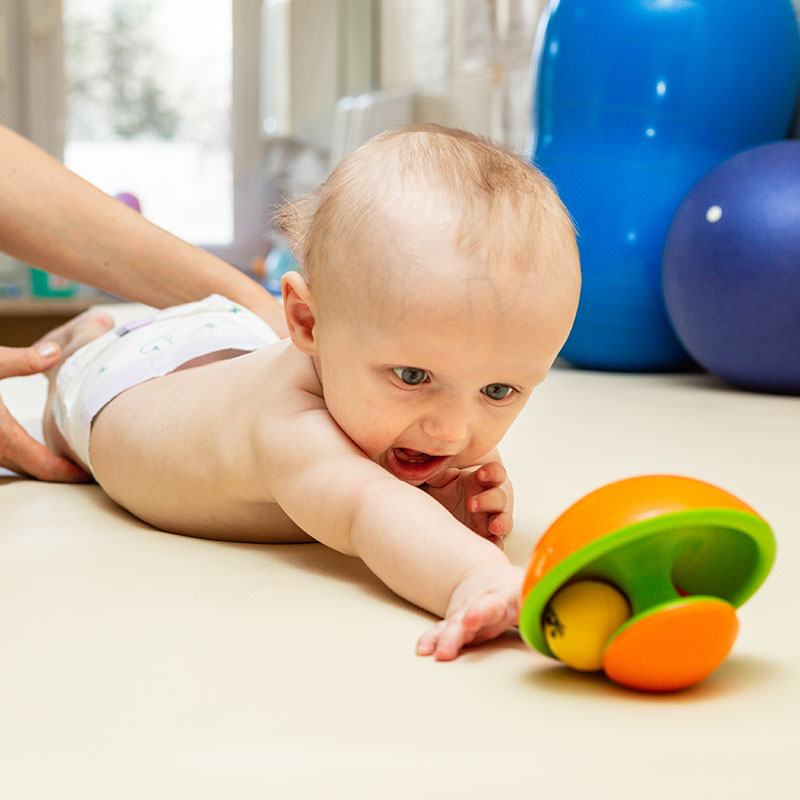 Baby Reaching For Toy
