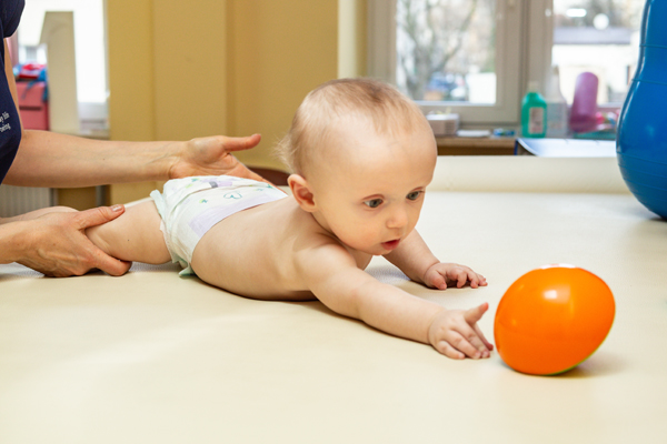 Pediatric Physical Therapy An Infant Exercising On A Table